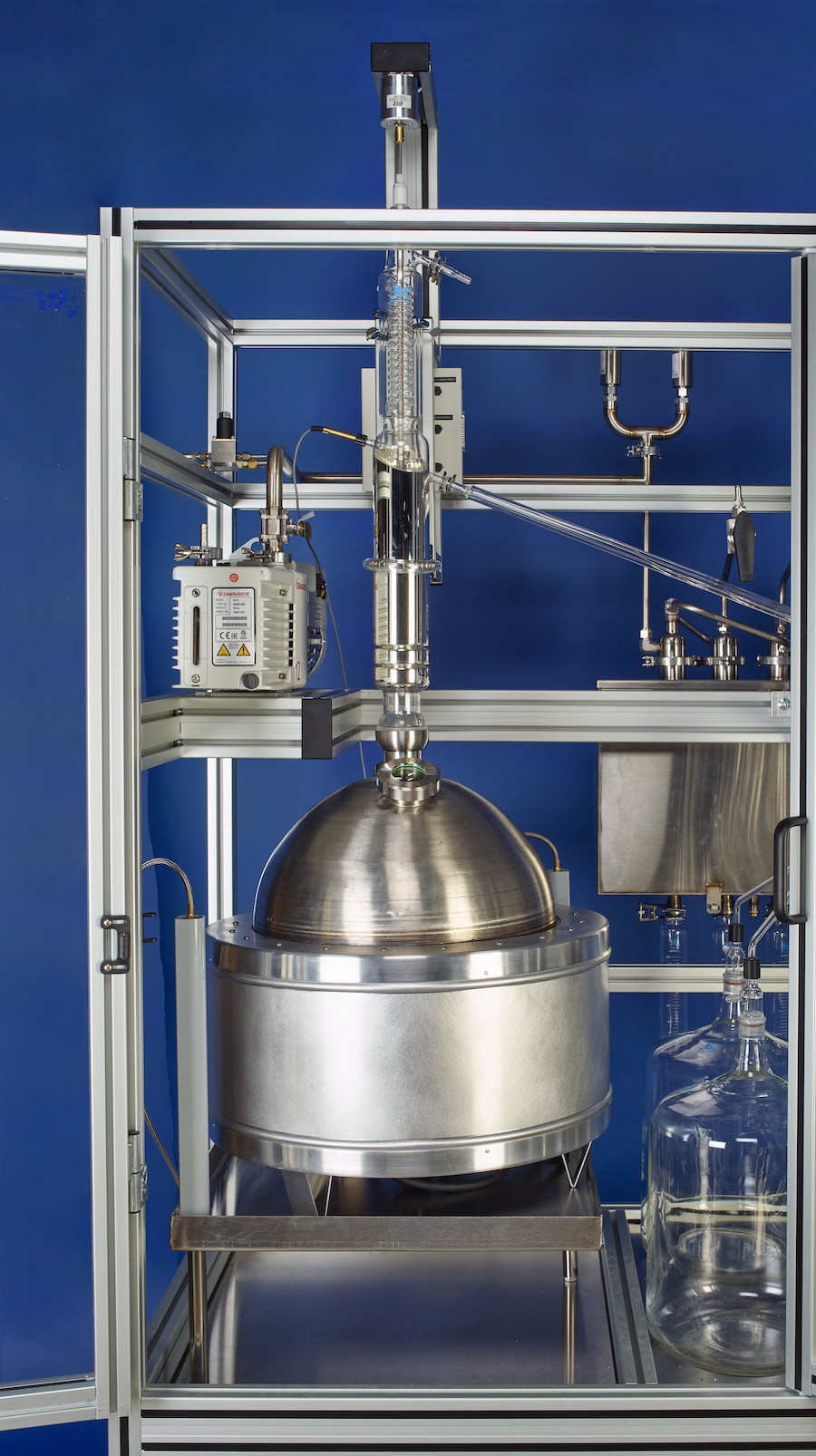 Spinning band column and stainless boiler inside a B/R distillation system